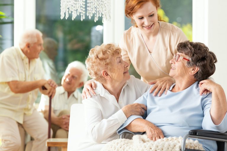 happy friendship in old age tender caregiver standing behind se